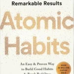 Book cover of Atomic Habits by James Clear, a guide to building powerful habits through small changes.
