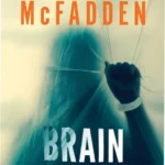 Paperback cover of Brain Damage by Freida McFadden showing a fractured silhouette against a dark background