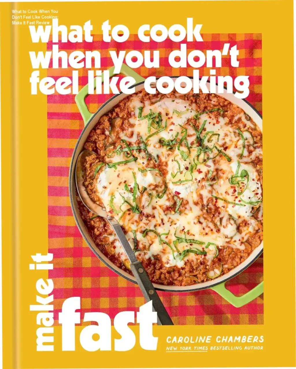 Caroline Chambers holding What to Cook When You Don't Feel Like Cooking Make It Fast cookbook cover showing fast dinner recipes